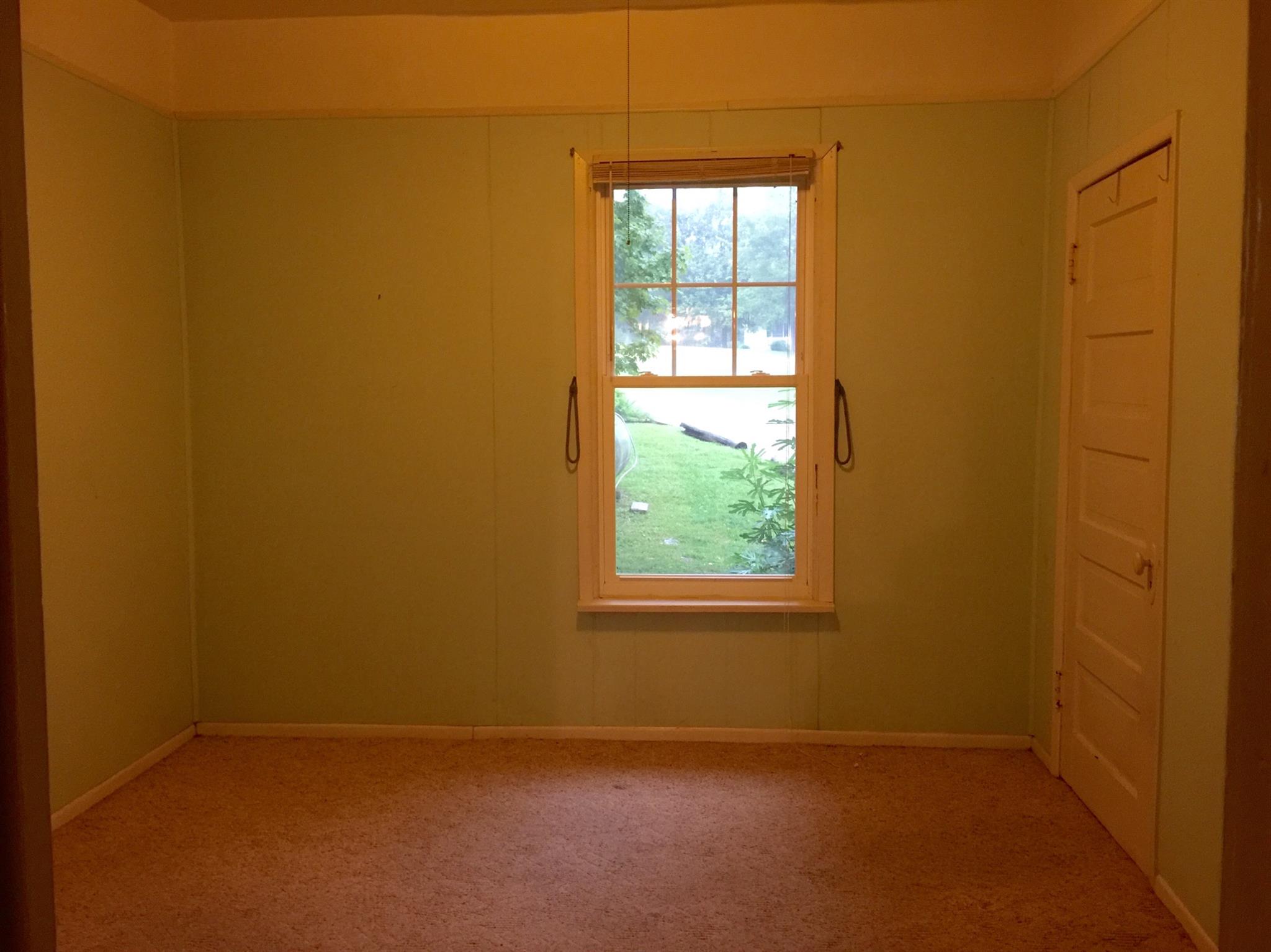 128 East Campbell Road Madison, TN 37115 - Photo 14 of 26 Second bedroom on main floor, with hardwoods under carpet.