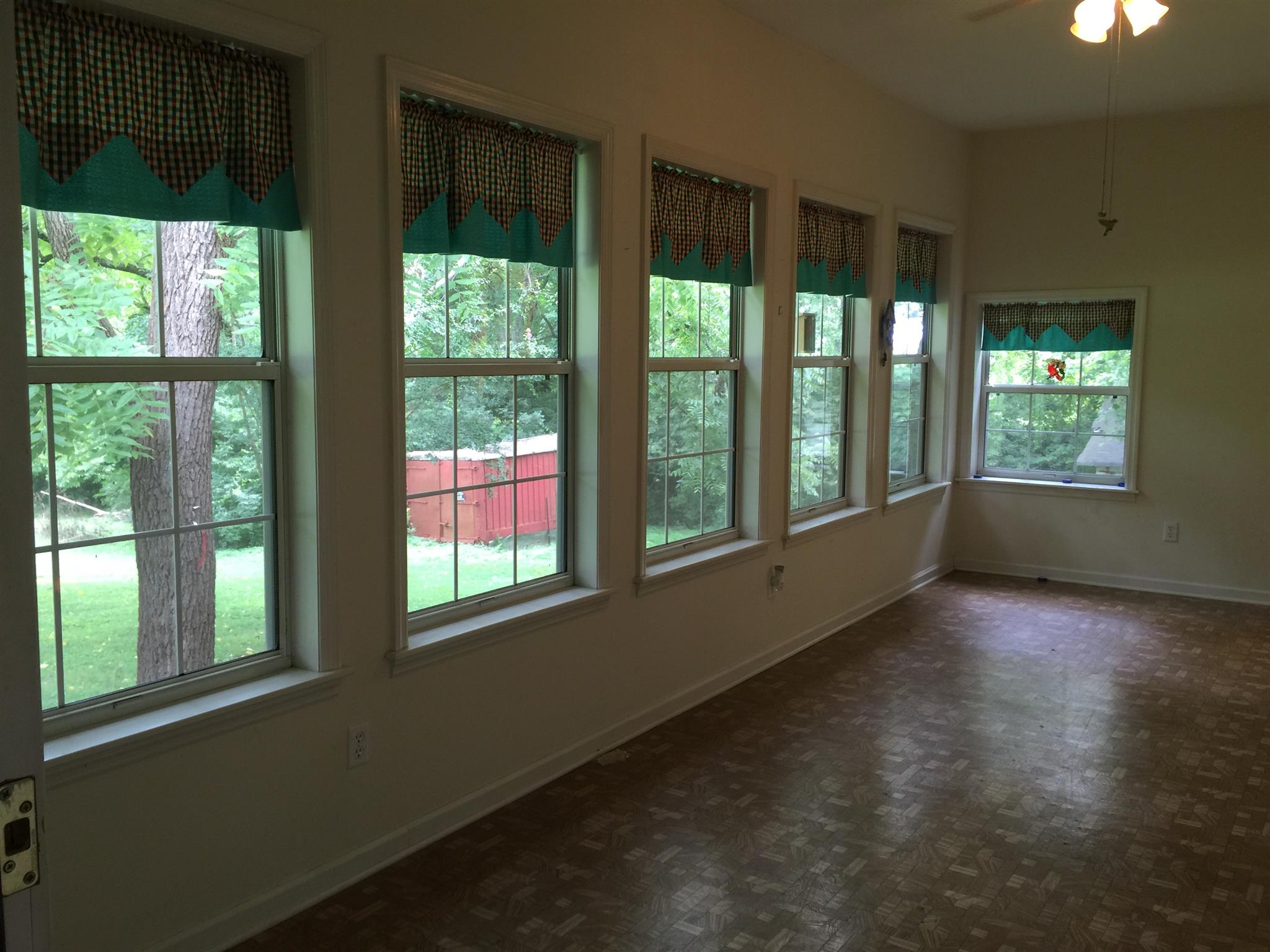 128 East Campbell Road Madison, TN 37115 - Photo 22 of 26 Sunroom with wall of windows! Overlooking gorgeous, lush backyard.