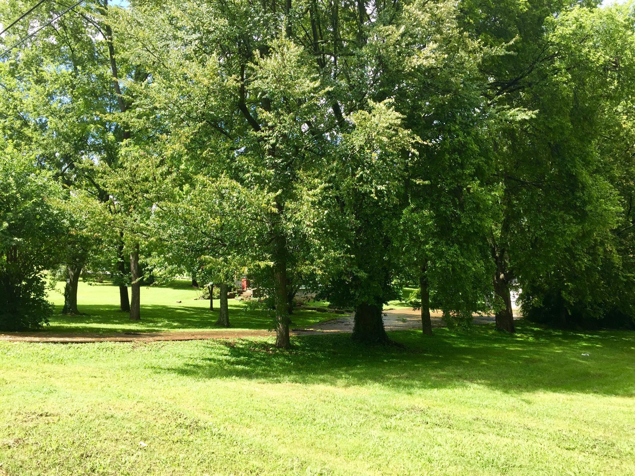 128 East Campbell Road Madison, TN 37115 - Photo 4 of 26 This charming home sits on 2 beautiful acres with mature trees.