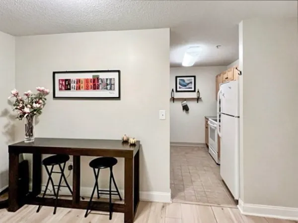 a view of a hallway with seating area