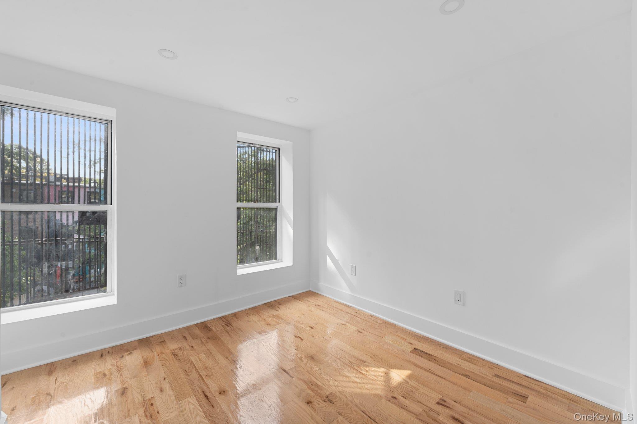 614 Madison Street Brooklyn, NY 11221 - Photo 11 of 14 an empty room with a window