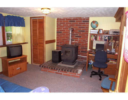 10 Edward Road Townsend, MA 01469 - Photo 6 of 11 a living room with furniture and a flat screen tv