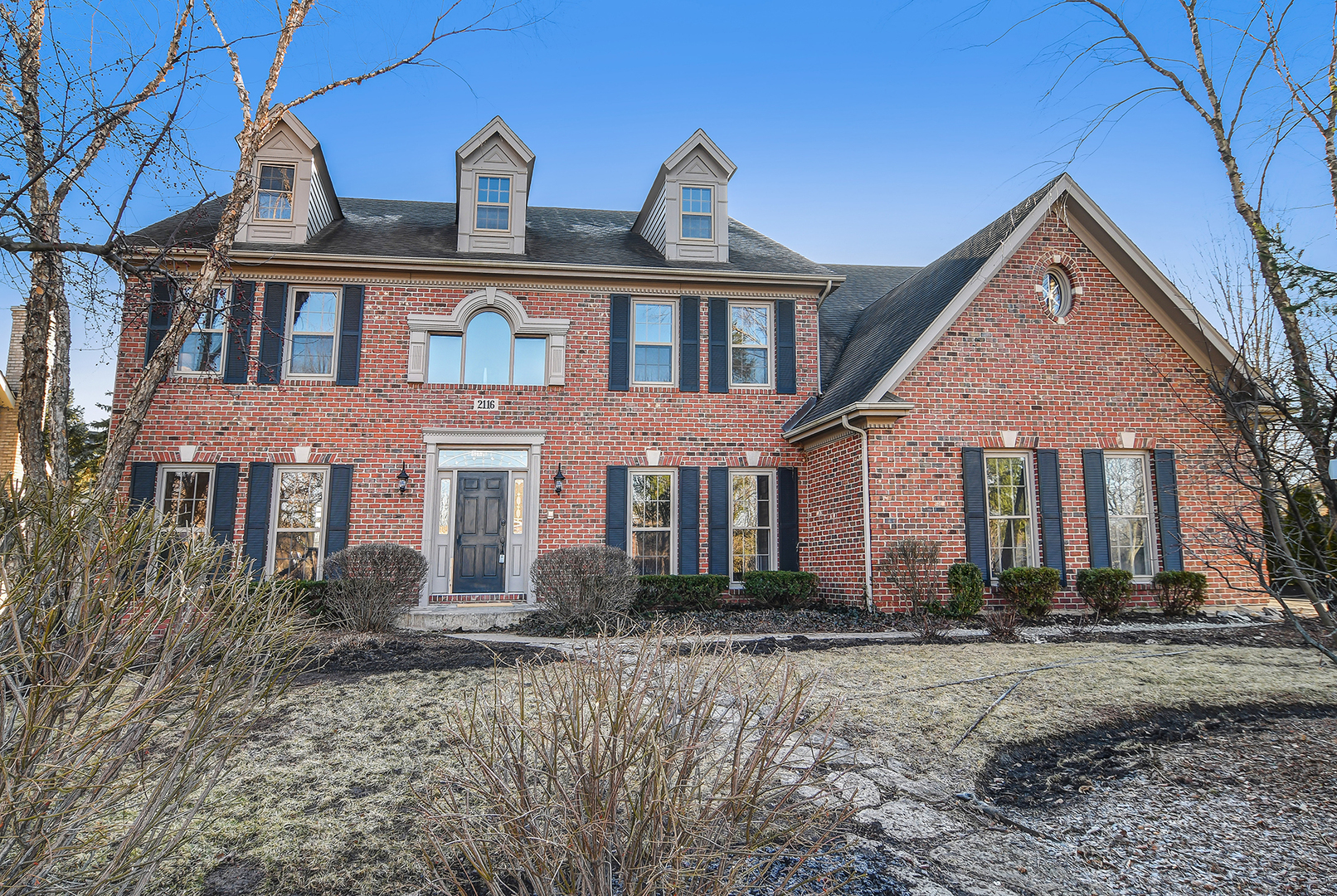 2116 Keim Road Naperville, IL 60565 - Photo 1 of 18 a front view of house with yard and trees in the background