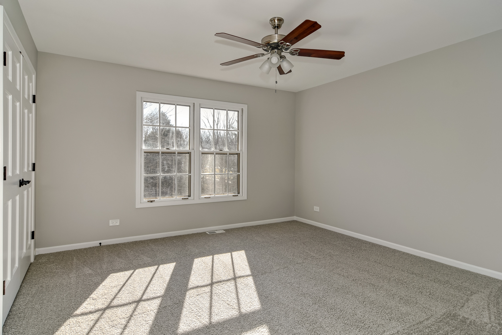 2116 Keim Road Naperville, IL 60565 - Photo 13 of 18 an empty room with a window and a fan