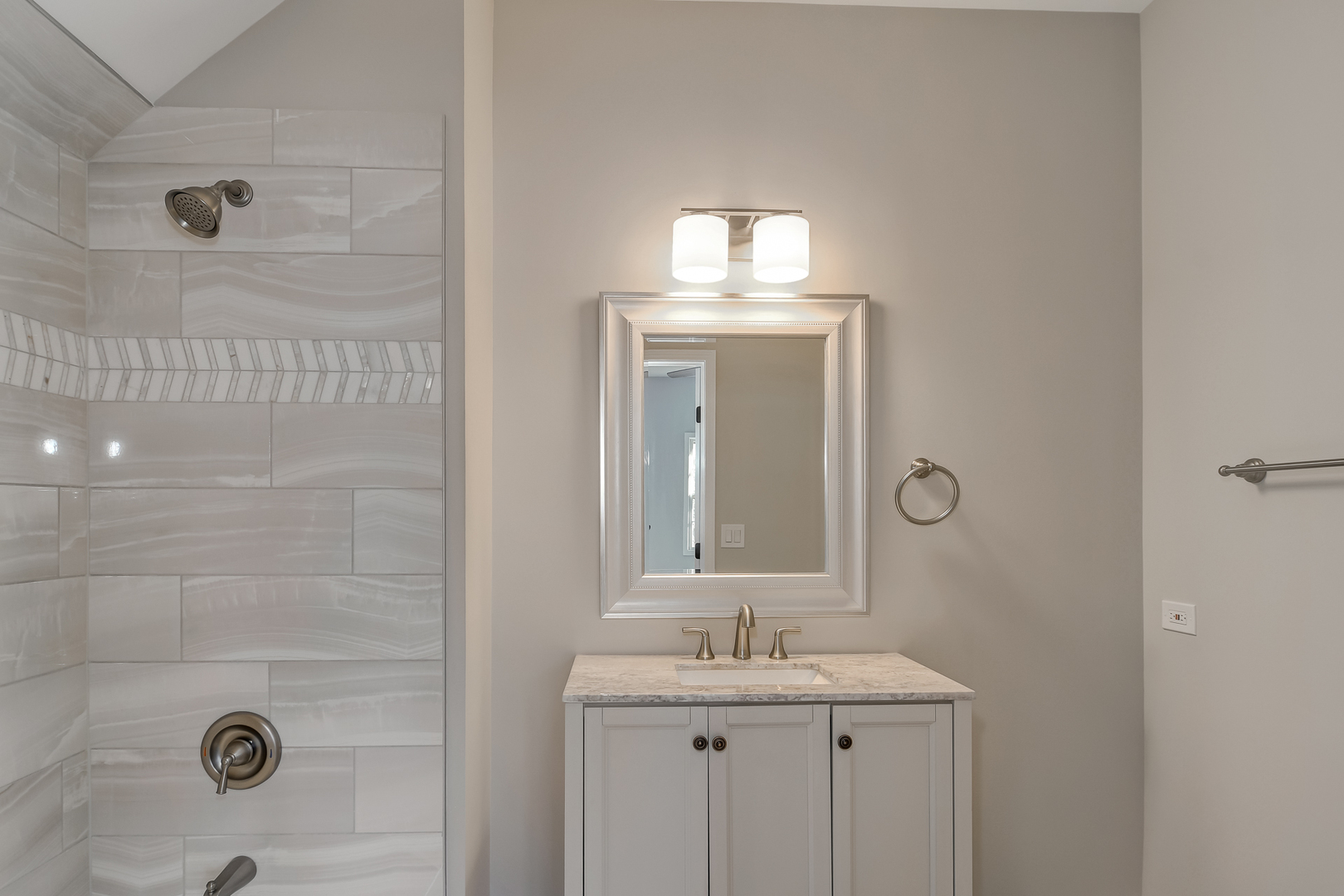 2116 Keim Road Naperville, IL 60565 - Photo 14 of 18 a bathroom with a granite countertop sink a mirror and shower