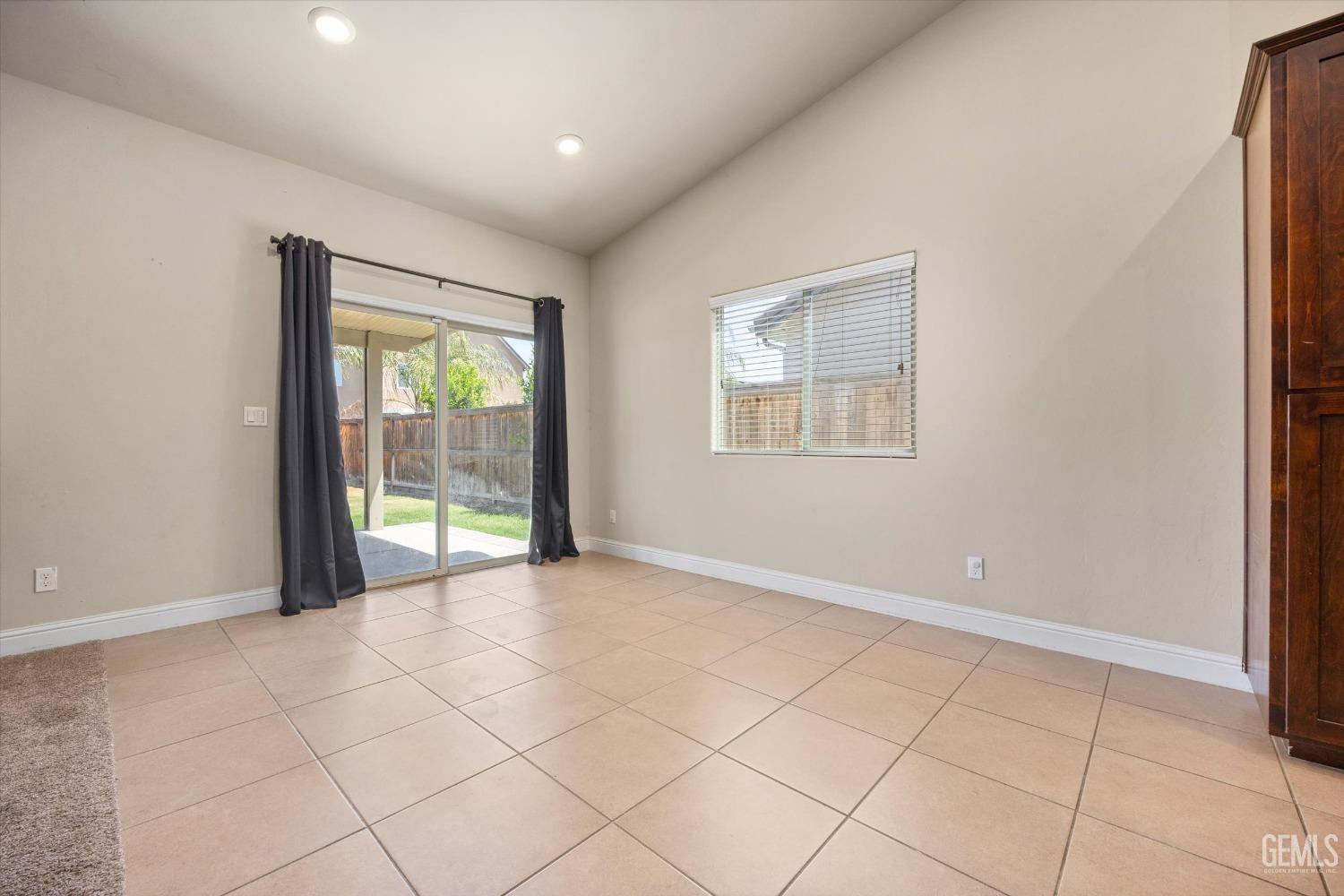 Undisclosed Address Shafter, CA 93263 - Photo 11 of 29 a view of an empty room with a window