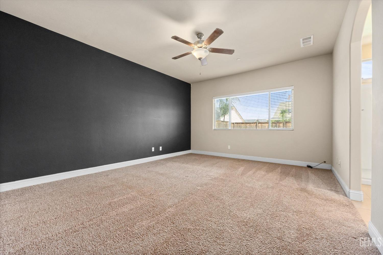 Undisclosed Address Shafter, CA 93263 - Photo 13 of 29 an empty room with windows and fan