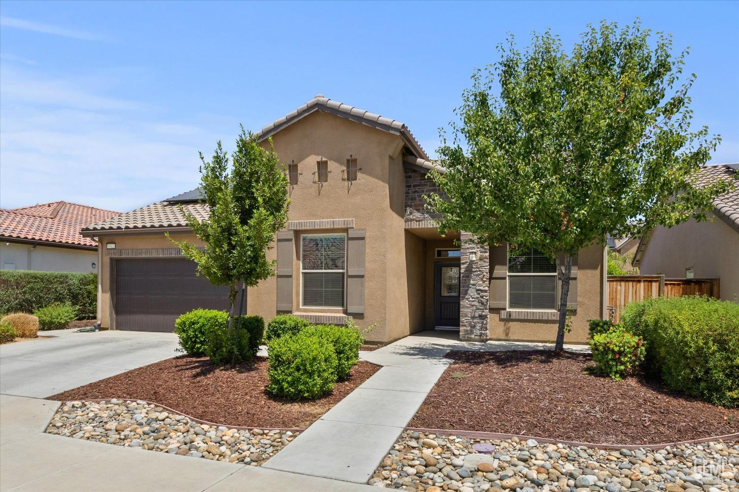 Undisclosed Address Shafter, CA 93263 - Photo 2 of 29 a front view of a house with garden