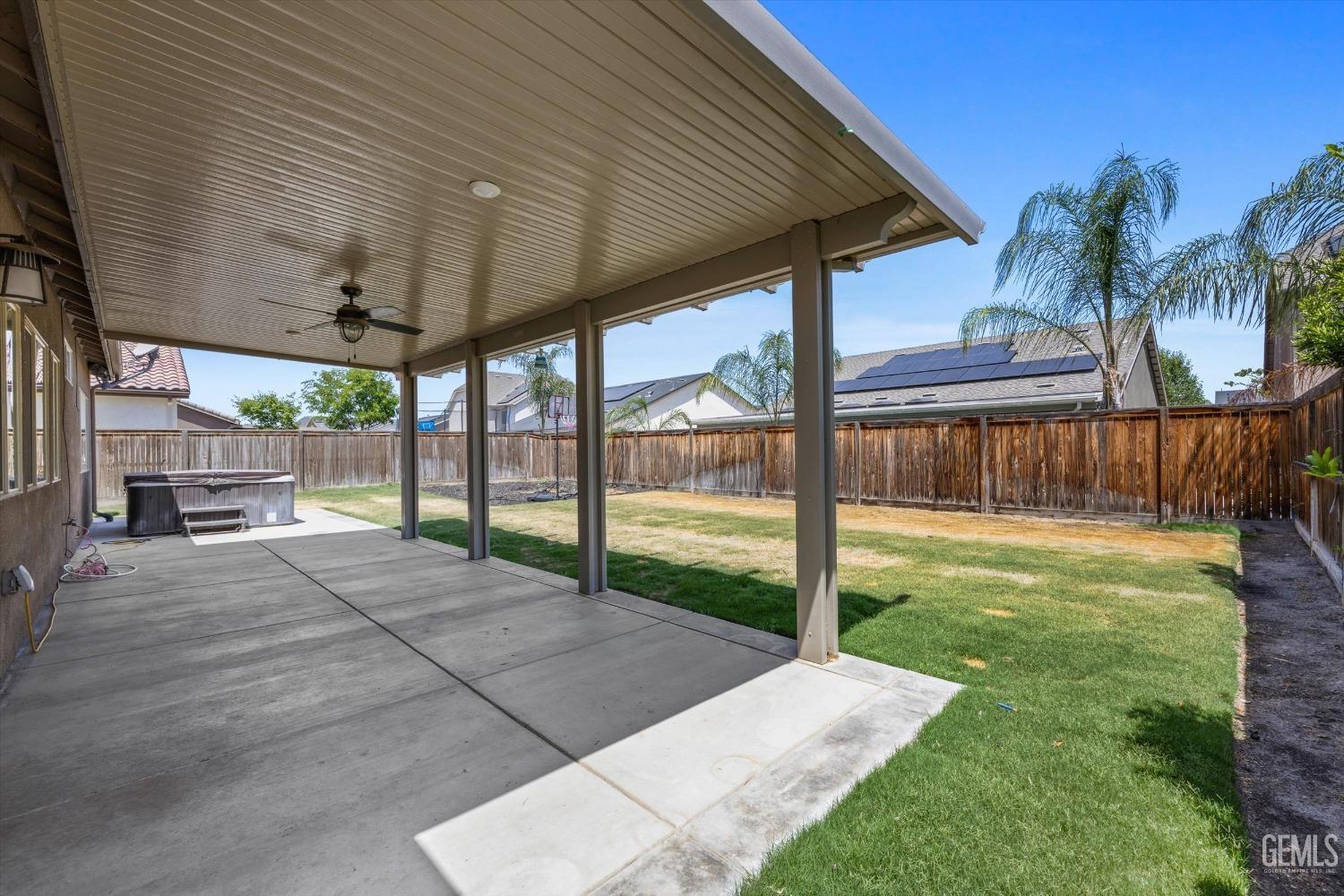 Undisclosed Address Shafter, CA 93263 - Photo 26 of 29 a view of a backyard with couches plants and large tree