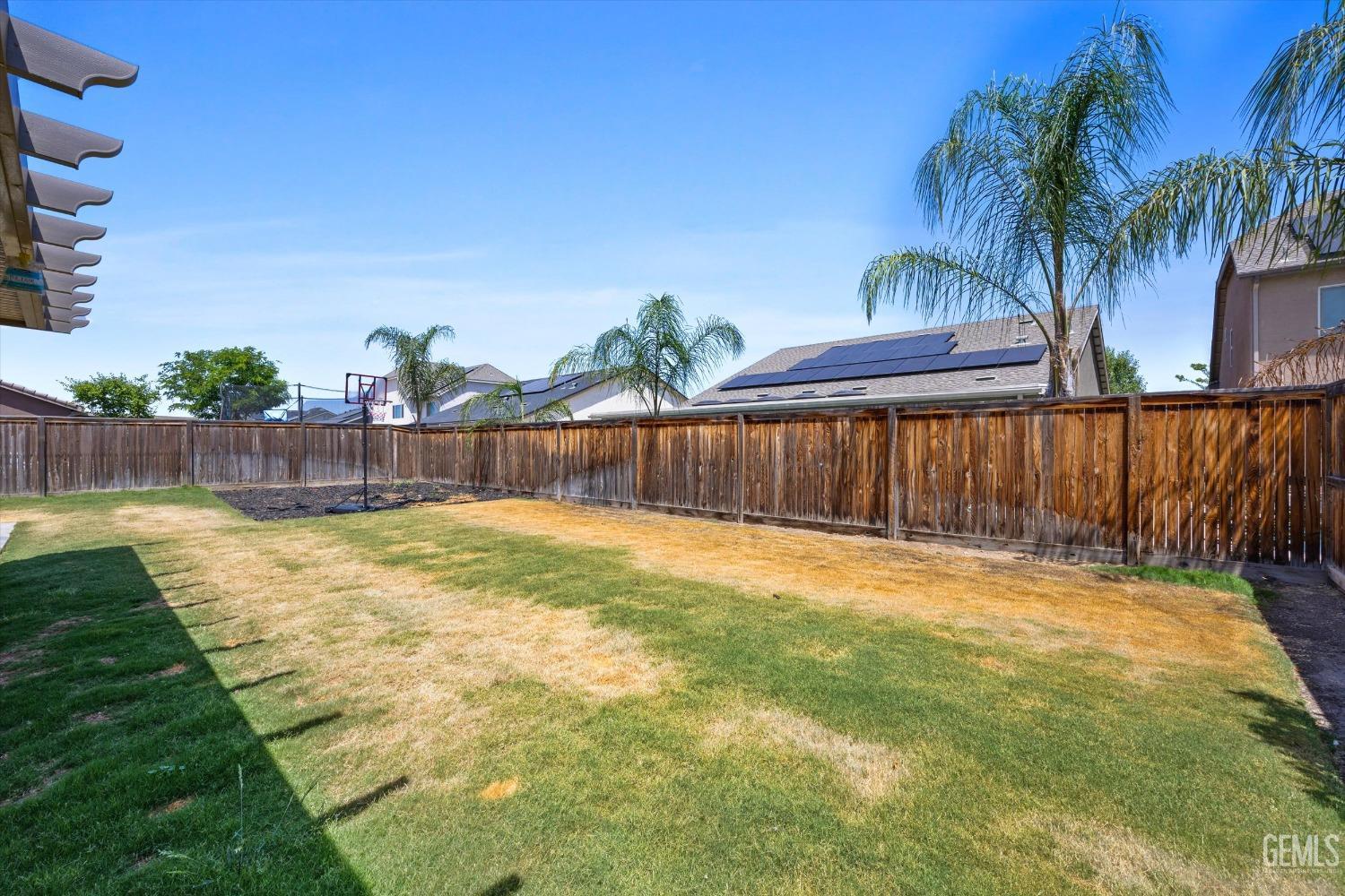 Undisclosed Address Shafter, CA 93263 - Photo 27 of 29 a swimming pool with wooden fence
