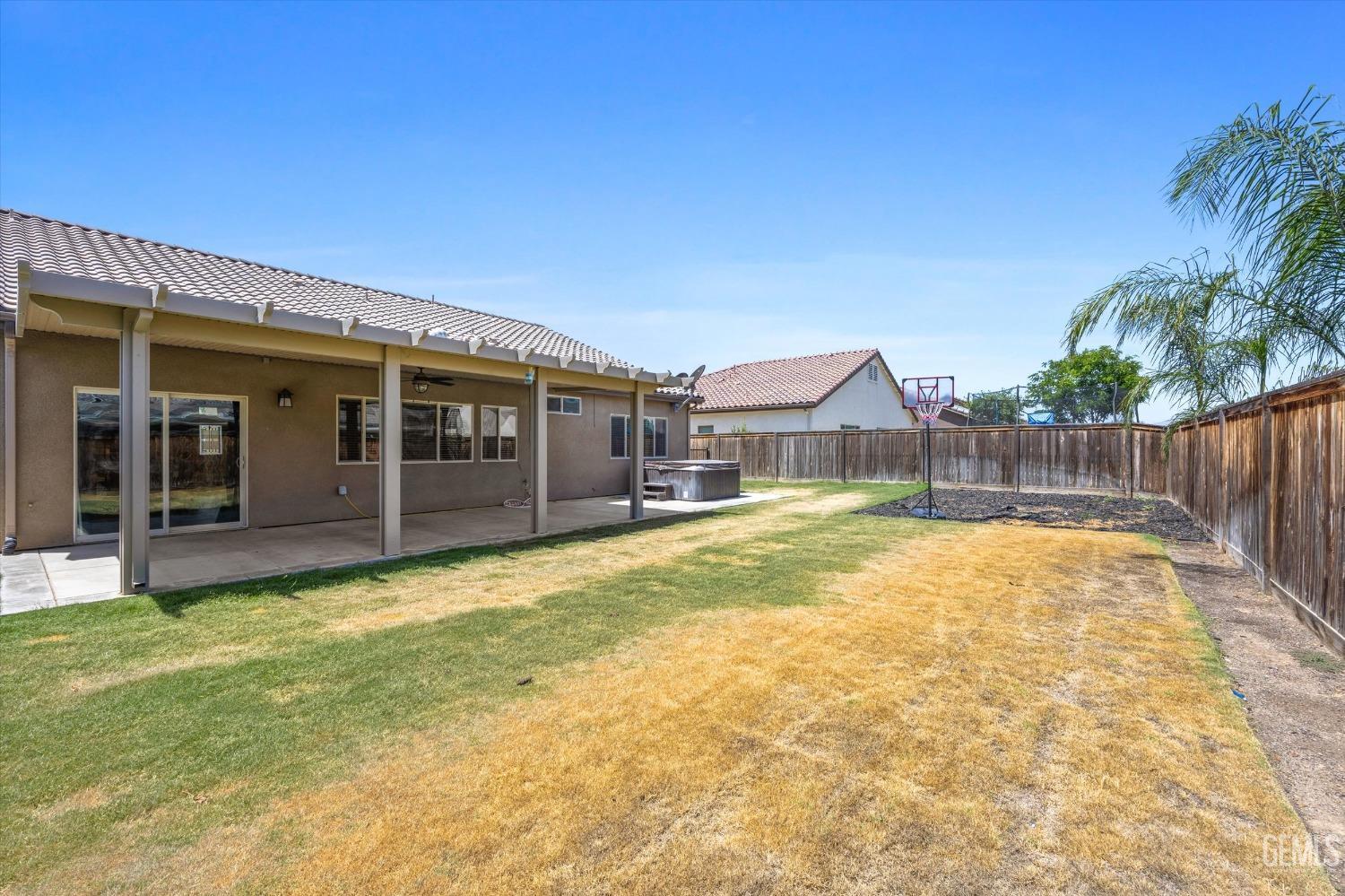 Undisclosed Address Shafter, CA 93263 - Photo 28 of 29 a swimming pool with yard in front of it