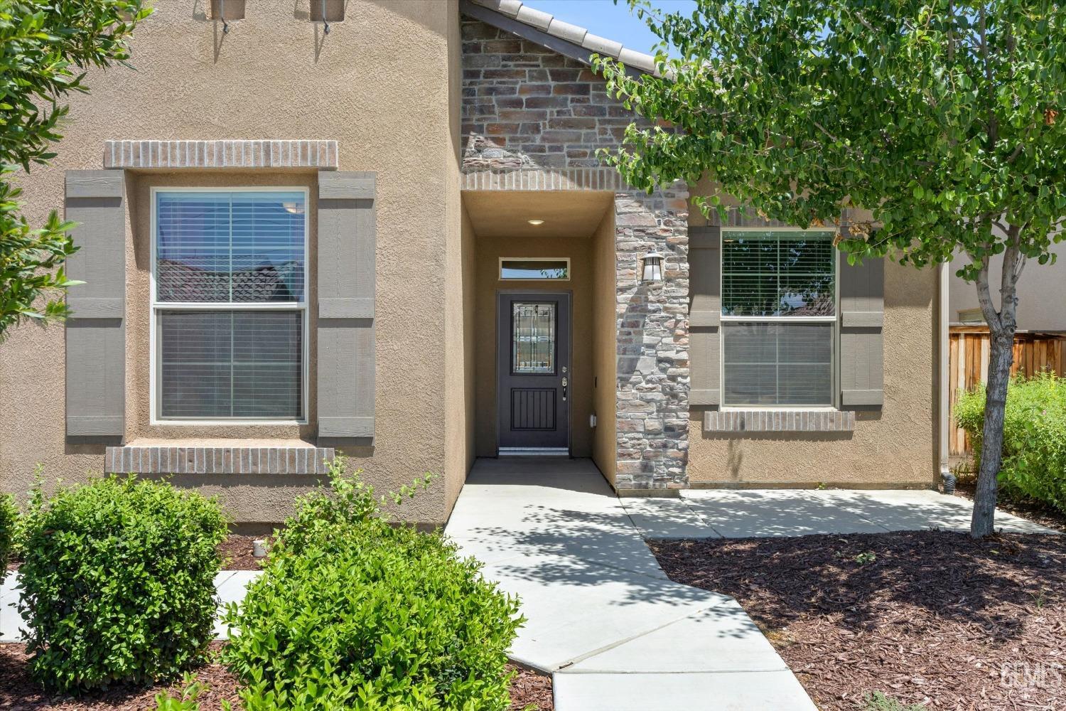 Undisclosed Address Shafter, CA 93263 - Photo 3 of 29 a front view of a house with a yard