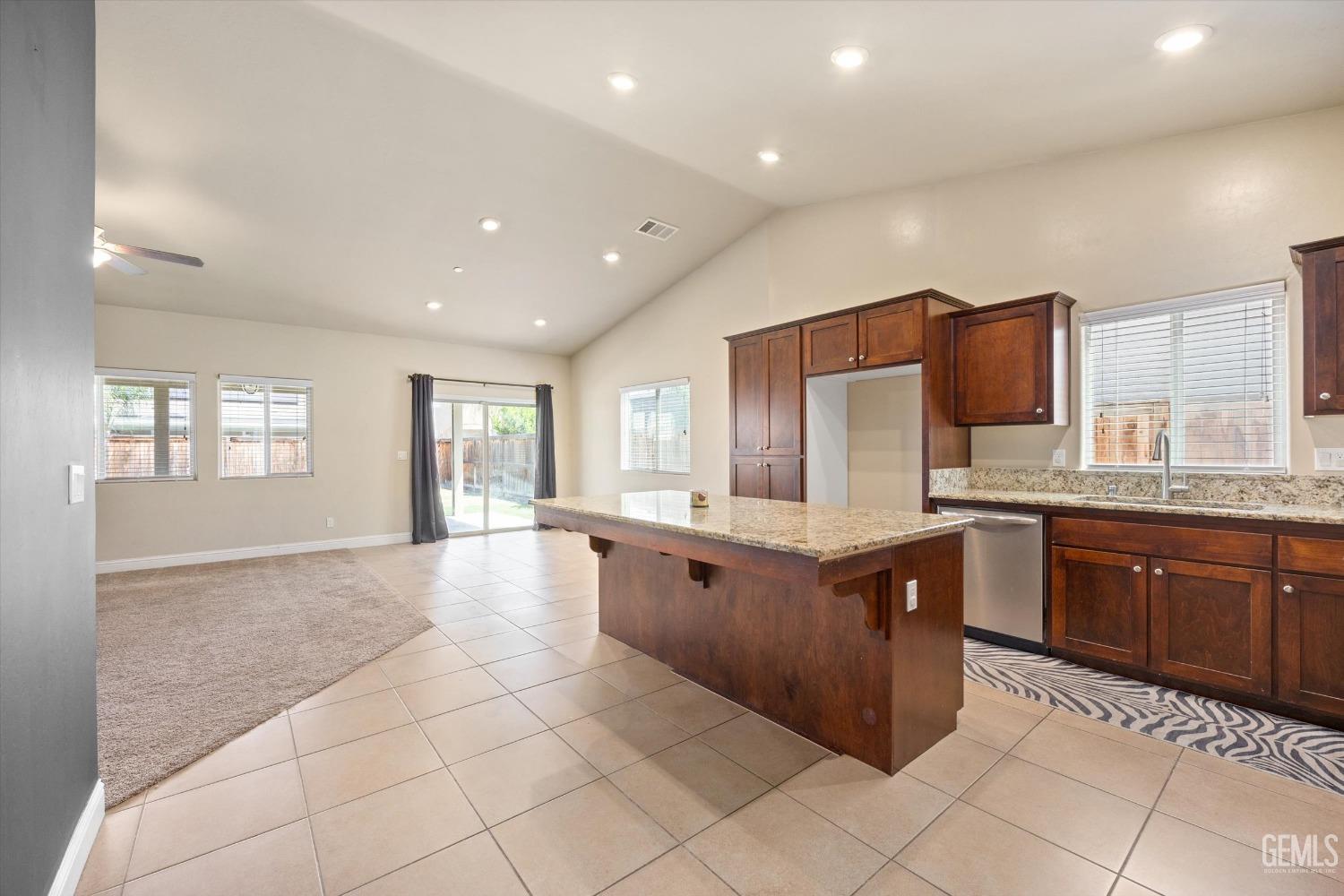 Undisclosed Address Shafter, CA 93263 - Photo 4 of 29 a large kitchen with stainless steel appliances granite countertop a large counter sink and cabinets