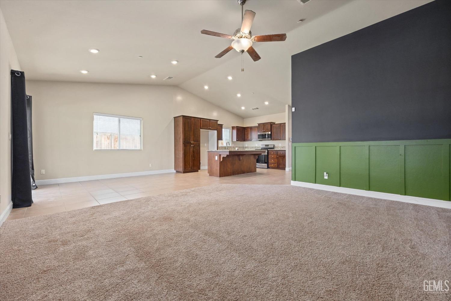 Undisclosed Address Shafter, CA 93263 - Photo 10 of 29 a view of an empty room with a window and fireplace
