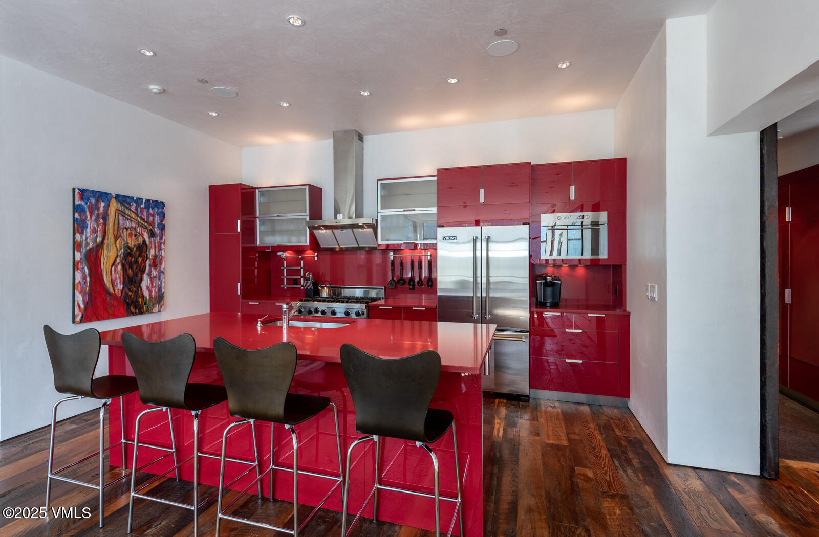 1449 Buffehr Creek Road Vail, CO 81657 - Photo 12 of 41 a view of a dining room with furniture and wooden floor