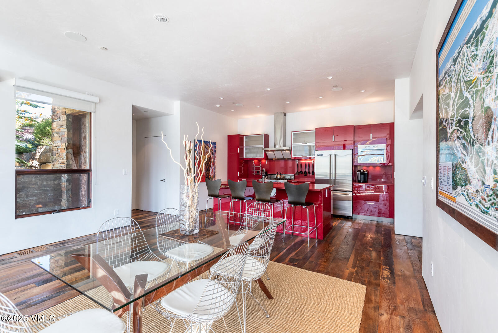 1449 Buffehr Creek Road Vail, CO 81657 - Photo 15 of 41 a living room with lots of furniture and kitchen view