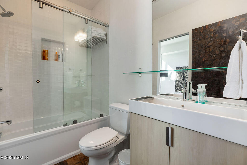 1449 Buffehr Creek Road Vail, CO 81657 - Photo 21 of 41 a bathroom with a sink a toilet and shower