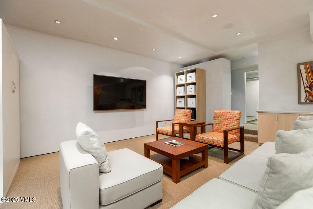 1449 Buffehr Creek Road Vail, CO 81657 - Photo 27 of 41 a living room with furniture and a flat screen tv
