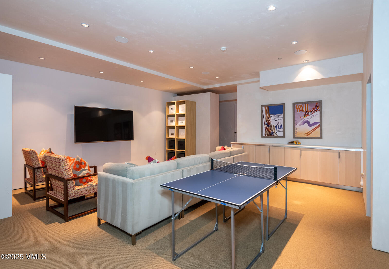 1449 Buffehr Creek Road Vail, CO 81657 - Photo 29 of 41 a living room with furniture and a flat screen tv
