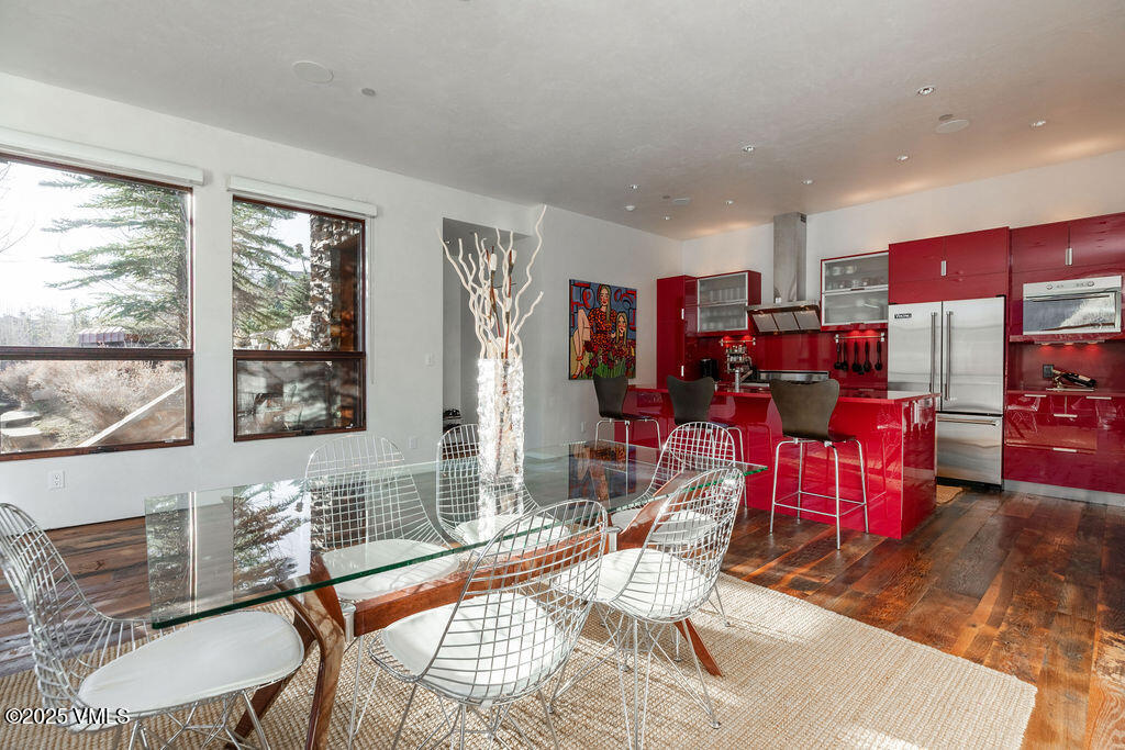 1449 Buffehr Creek Road Vail, CO 81657 - Photo 9 of 41 a living room with furniture kitchen view and large windows