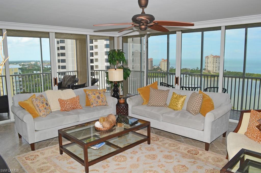 5550 Heron Point Drive, Unit 1804 Naples, FL 34108 - Photo 6 of 17 a living room with furniture and a large window