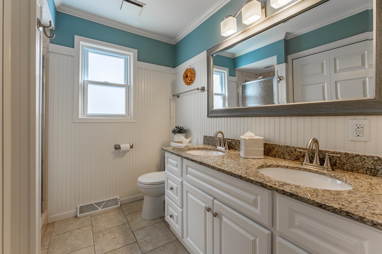 1435 Pier Drive Lake Summerset, IL 61019 - Photo 13 of 35 a bathroom with a granite countertop toilet sink and mirror