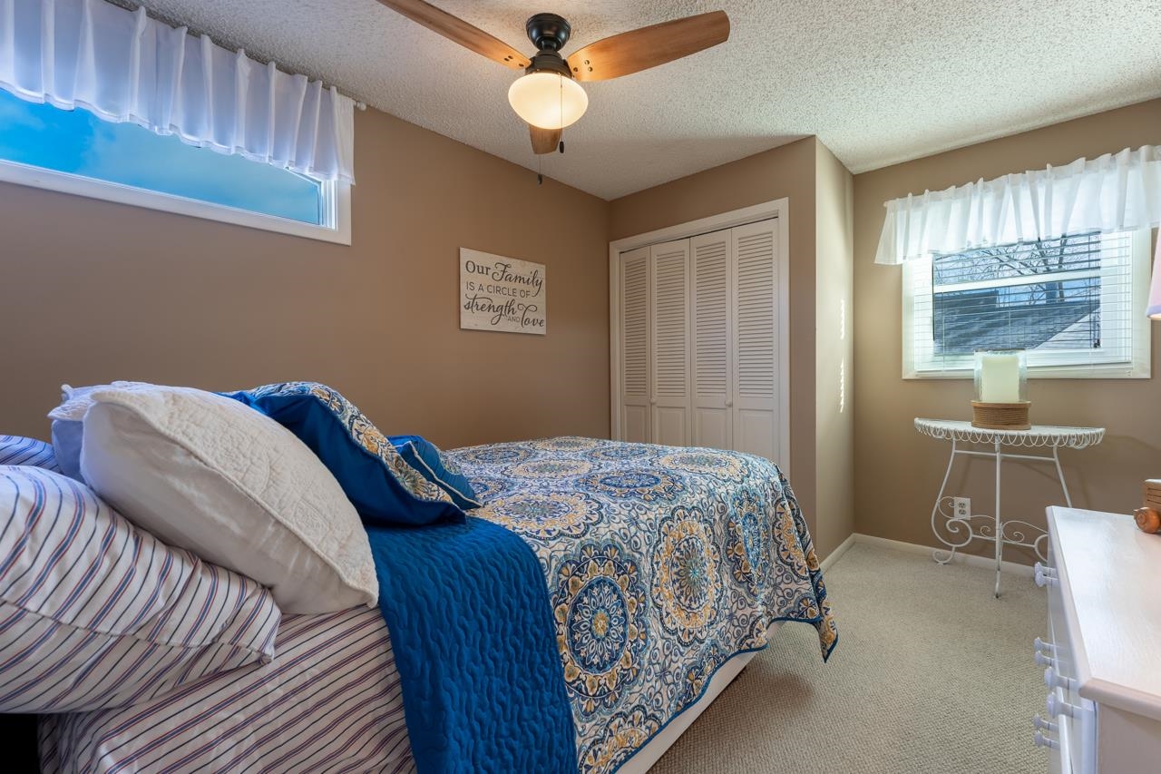 1435 Pier Drive Lake Summerset, IL 61019 - Photo 18 of 35 a bedroom with a bed and a chandelier