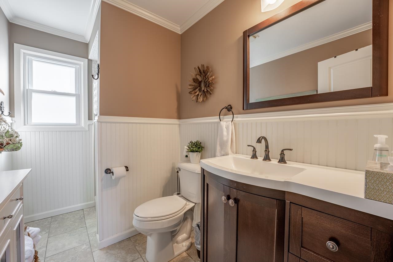 1435 Pier Drive Lake Summerset, IL 61019 - Photo 20 of 35 a bathroom with a sink a toilet and a mirror
