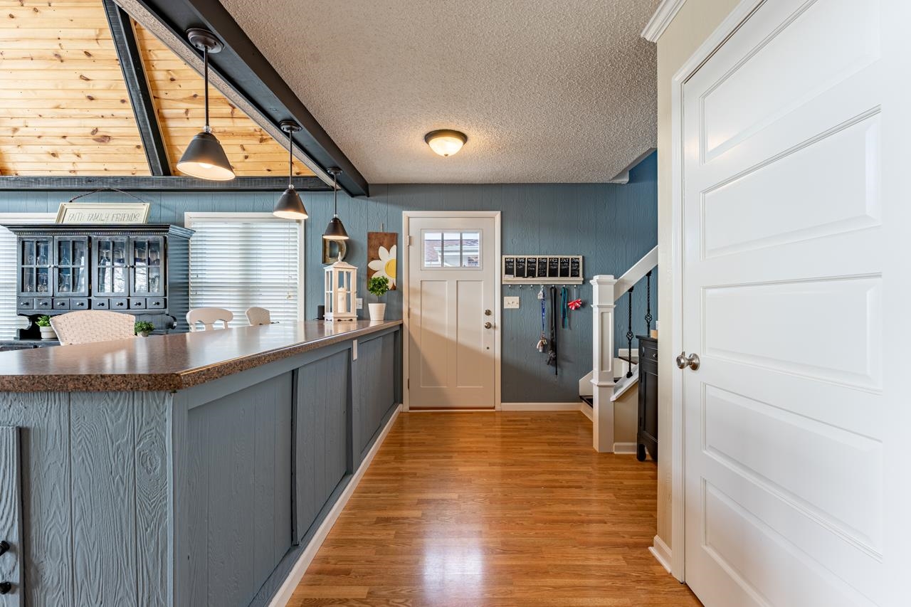 1435 Pier Drive Lake Summerset, IL 61019 - Photo 10 of 35 a hallway view with wooden floor and staircase