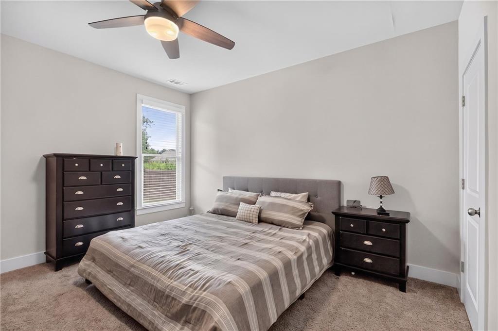 139 Manchester Lane Villa Rica, GA 30180 - Photo 23 of 60 a bedroom with a bed and a closet