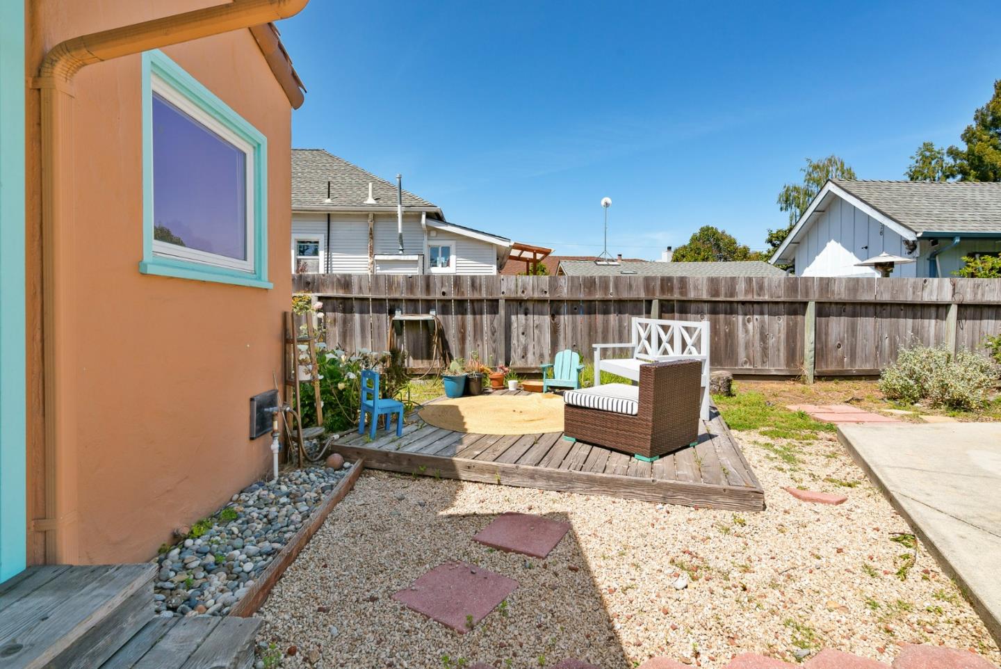 620 Sumner Street Santa Cruz, CA 95062 - Photo 39 of 45 a view of a patio with couches chairs and wooden floor