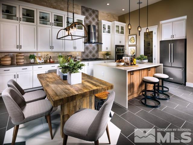 9520 Baldacci Court, Unit HOMESITE 33 Reno, NV 89521 - Photo 3 of 10 a dining room with wooden floor and breakfast area