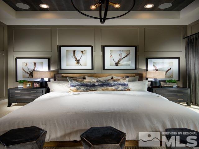 9520 Baldacci Court, Unit HOMESITE 33 Reno, NV 89521 - Photo 7 of 10 a bedroom with a bed and a large mirror