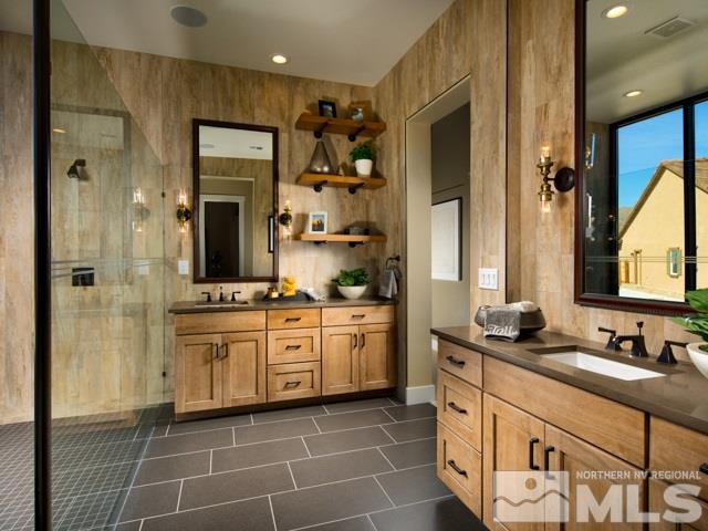 9520 Baldacci Court, Unit HOMESITE 33 Reno, NV 89521 - Photo 8 of 10 a spacious bathroom with a granite countertop sink mirror and a shower