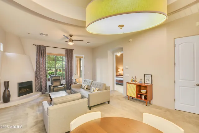 a living room with furniture and a fireplace