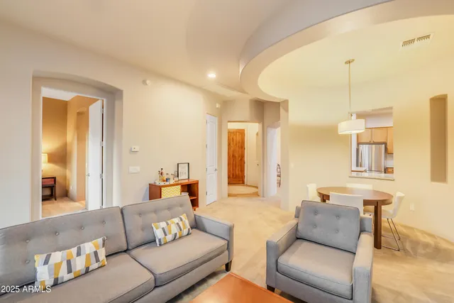 a living room with furniture and a couch