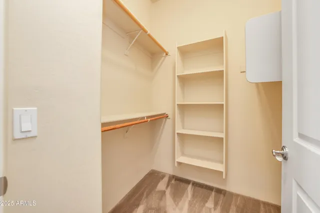 a view of an empty walk in closet