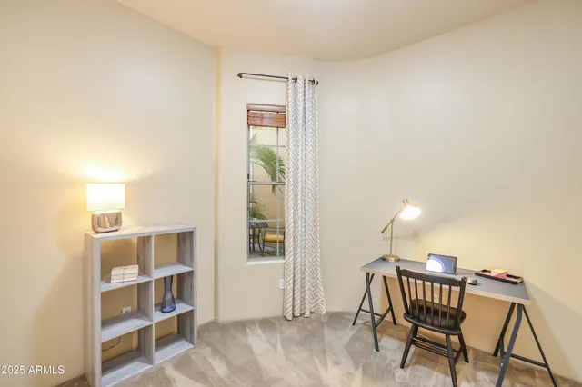 a view of a livingroom with furniture and cabinet