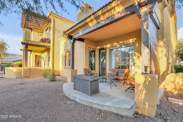 a view of an house with backyard of the house