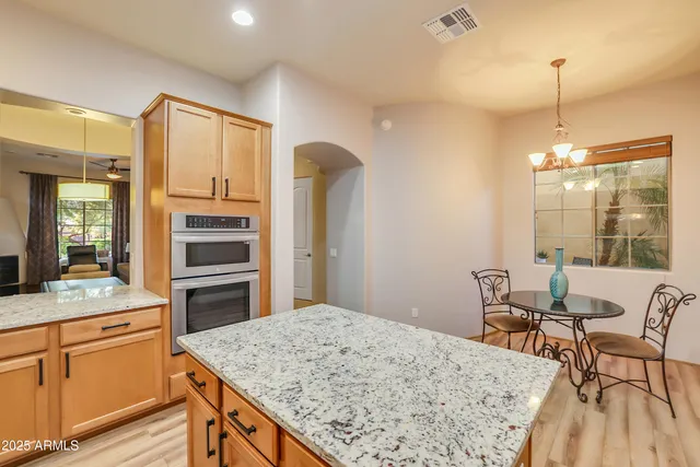 a kitchen with a table and chairs in it