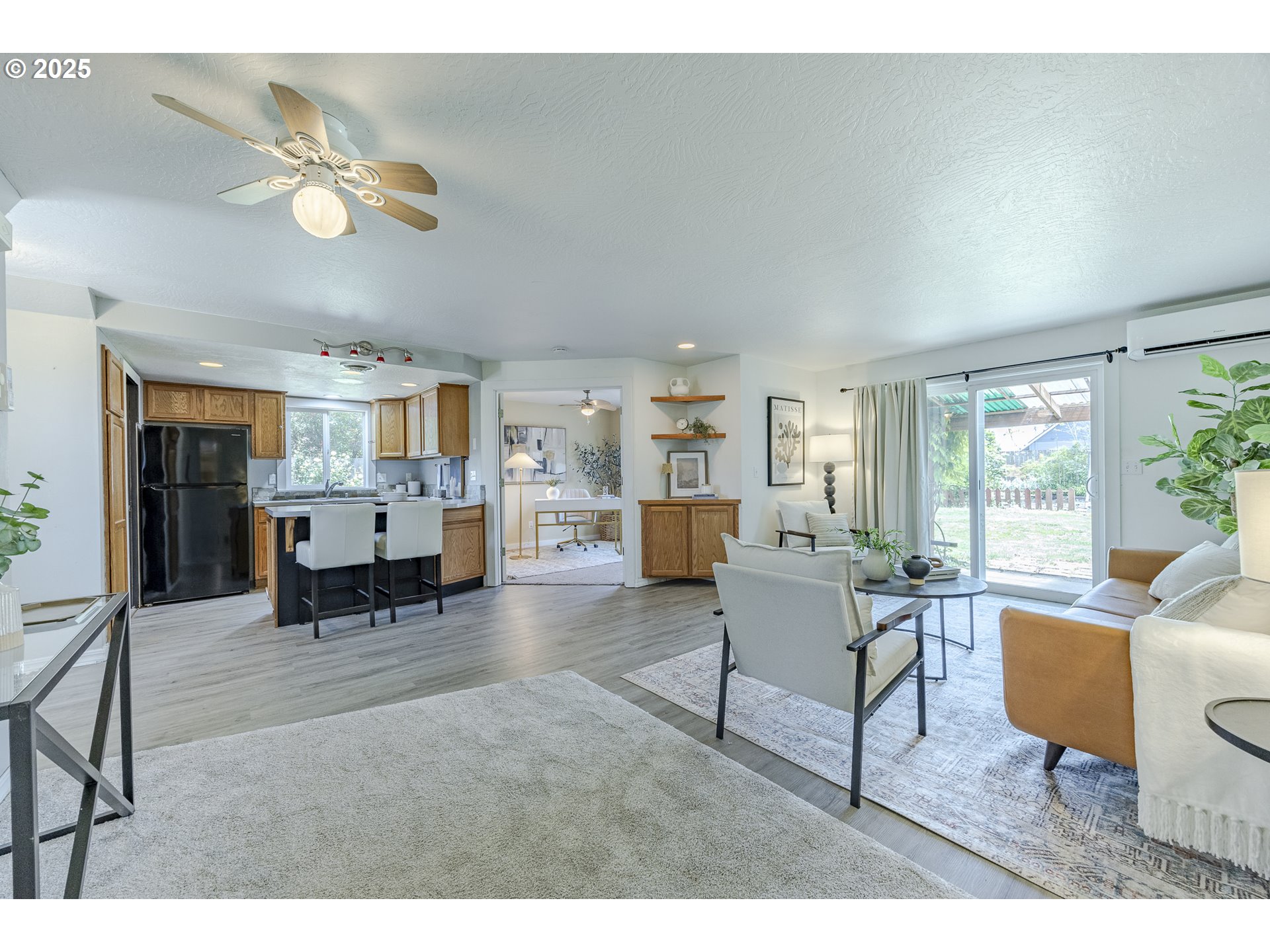 397 South 32nd Street Springfield, OR 97478 - Photo 3 of 30 a living room with furniture and kitchen view