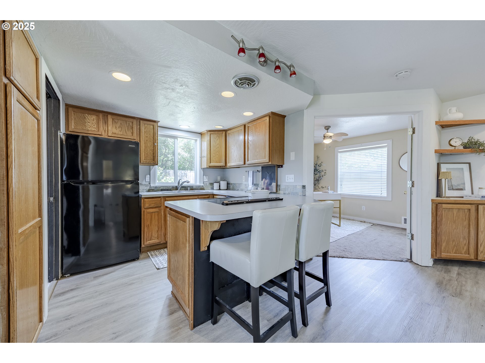 397 South 32nd Street Springfield, OR 97478 - Photo 6 of 30 a kitchen with stainless steel appliances granite countertop a refrigerator and a stove top oven