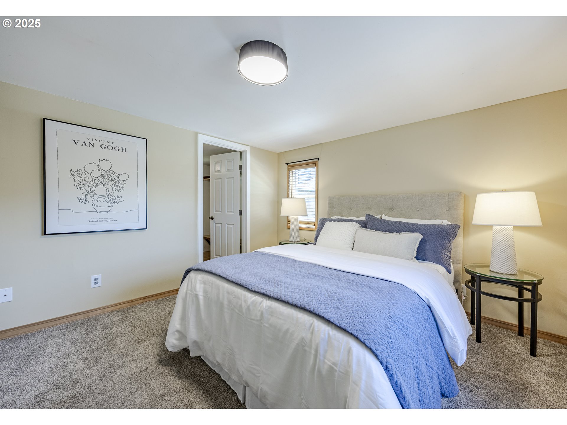 397 South 32nd Street Springfield, OR 97478 - Photo 8 of 30 a spacious bedroom with a bed and a lamp