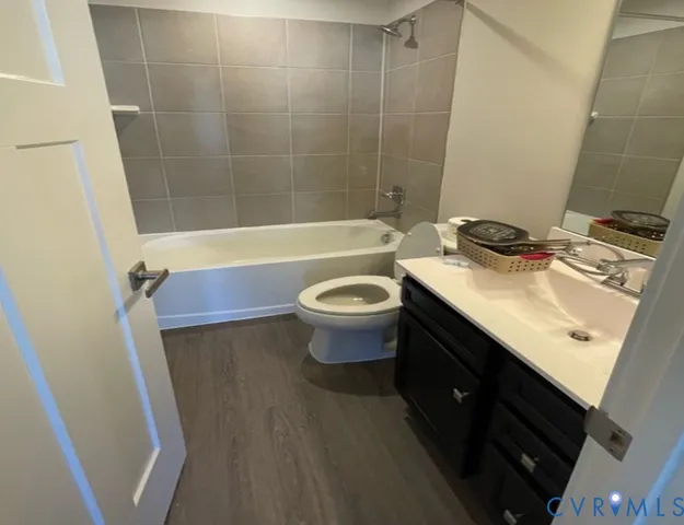 a view of an empty room with windows