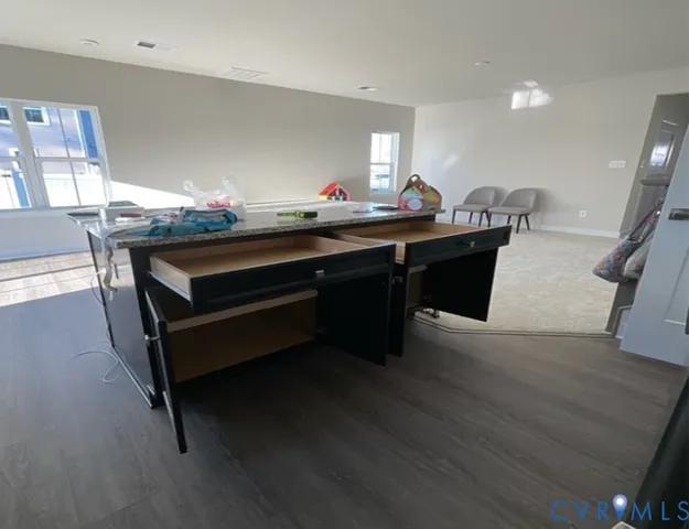 a room with furniture and wooden floor