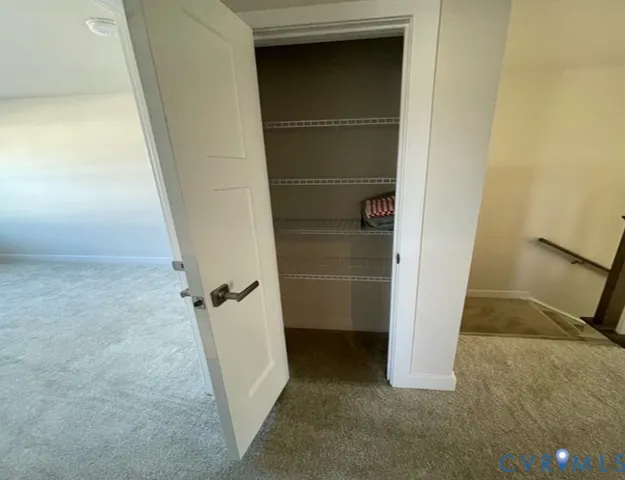 a bathroom with a sink a toilet a mirror and shower