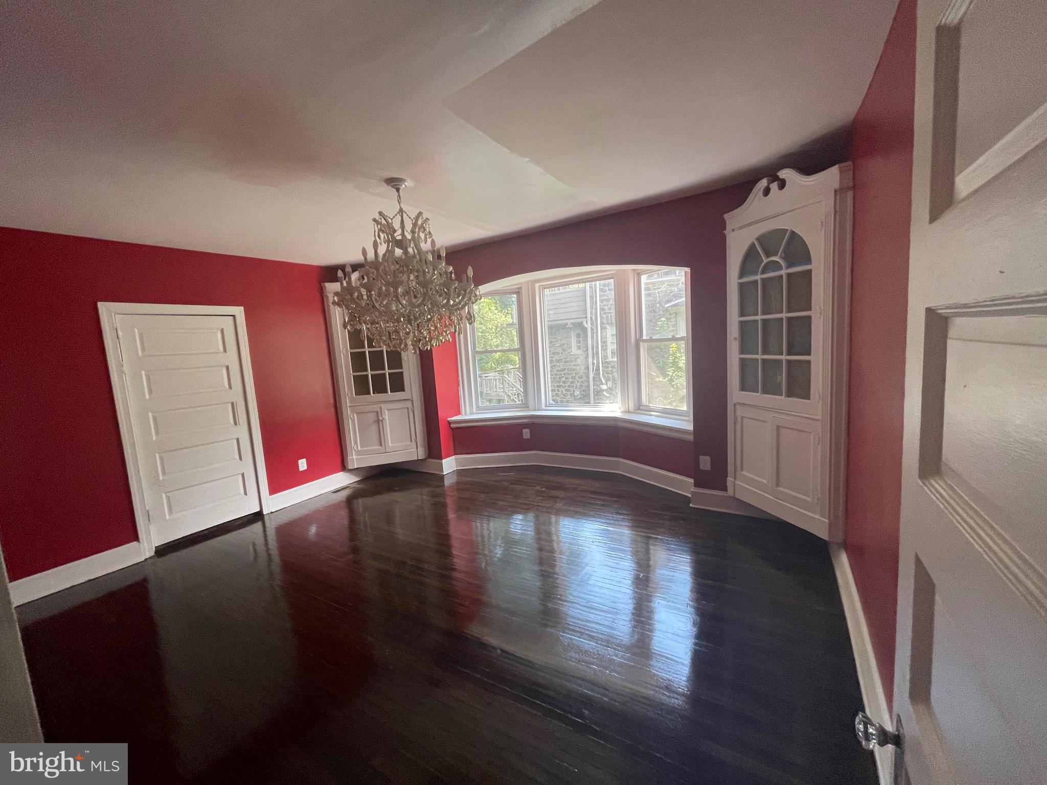 6416 Overbrook Avenue Philadelphia, PA 19151 - Photo 6 of 18 a view of empty room with wooden floor and fan
