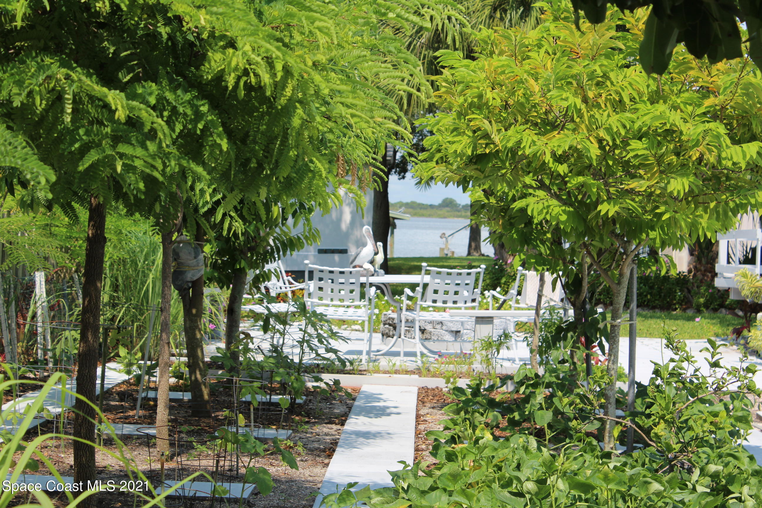 1775 Vía Roma Merritt Island, FL 32952 - Photo 34 of 41 View down garden