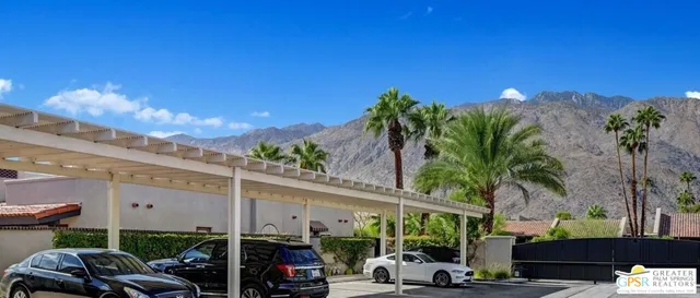 a view of a street with cars