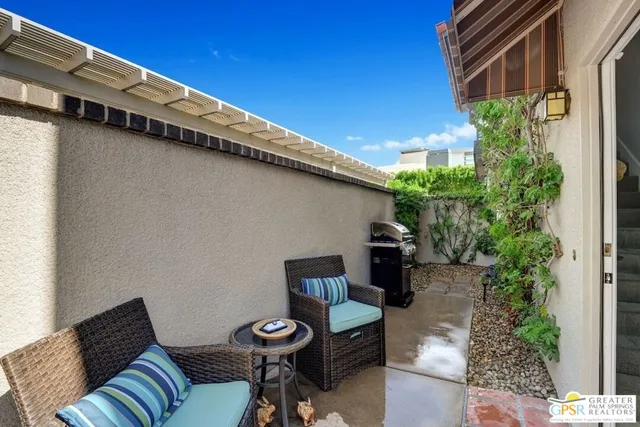 a backyard of a house with seating space